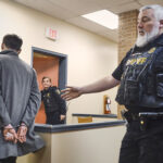 Jonathan Patten is led away in handcuffs by a sheriff after bieng convicted of impaired driving in provincial court at Harbour Grace, Newfoundland, April 14, 2026. Photo by Greg Locke © 2026