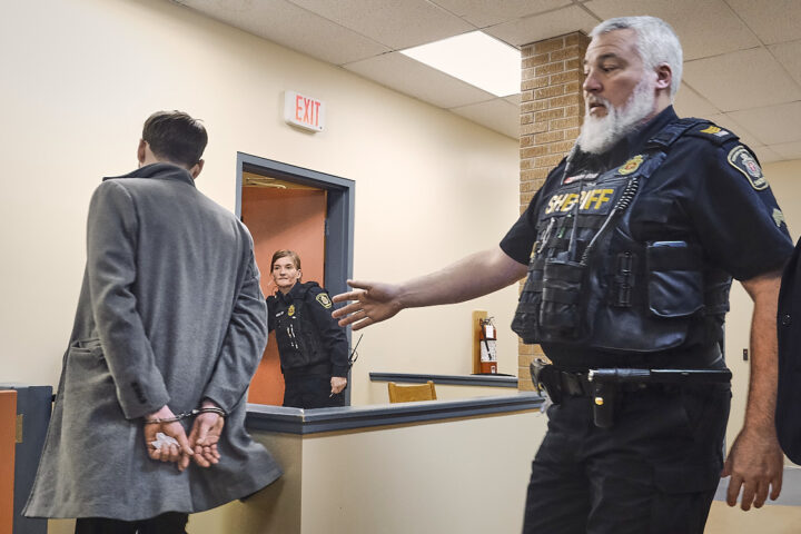 Jonathan Patten is led away in handcuffs by a sheriff after bieng convicted of impaired driving in provincial court at Harbour Grace, Newfoundland, April 14, 2026. Photo by Greg Locke © 2026